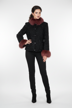 Įkelti nuotrauką į galerijos peržiūros programą, A woman modeling a black textured jacket with a contrasting burgundy faux-fur collar and cuffs, paired with black pants and black boots, against a plain white studio background.