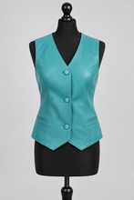 Įkelti nuotrauką į galerijos peržiūros programą, A sleeveless turquoise faux-leather vest displayed on a black dress form mannequin against a light gray studio background.