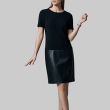 Load image into Gallery viewer, Vilniaus Kailiai Mod. 14836xxx dress featuring a stylish design, displayed on a hanger with fabric details and vibrant colors.