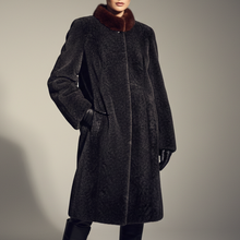 Įkelti nuotrauką į galerijos peržiūros programą, A model wears a dark charcoal gray textured coat with a contrasting dark brown fur collar, paired with black leather gloves and black leather knee-high boots, set against a plain gray studio background.