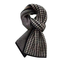 Load image into Gallery viewer, A knitted unisex scarf with a geometric pattern in black and white, displayed in a loop shape.