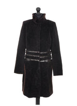 Load image into Gallery viewer, A dark chocolate brown knee length sheepskin fur coat with a regular collar and fur cuffs, displayed on a mannequin.