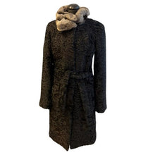Load image into Gallery viewer, A black knee-length astrakhan fur coat with a tie and chinchilla collar, featuring front pockets and fur hooks fastening.