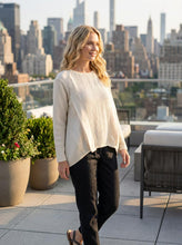 Load image into Gallery viewer, Woman standing on a rooftop with a city skyline in the background