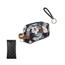 Load image into Gallery viewer, A black PU leather squeeze case with a floral pattern and a keychain, designed for eyewear. The case is closed, and a textile cosmetic bag is shown beside it.