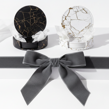 Load image into Gallery viewer, Marble-patterned coasters with a gray bow on a white background