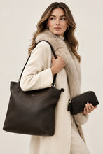 Įkelti nuotrauką į galerijos peržiūros programą, A black textile cosmetic bag with leather accents and a black leather handbag with a zipper.