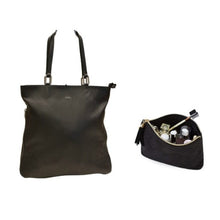 Load image into Gallery viewer, A black textile cosmetic bag with leather accents and a black leather handbag with a zipper.