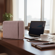 Load image into Gallery viewer, Laptop on a table with a pink case in a modern office setting