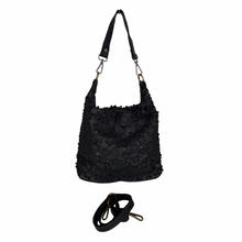 Load image into Gallery viewer, Black textured handbag with a strap on a white background