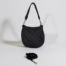 Load image into Gallery viewer, Black woven handbag with a matching keychain on a light gray background