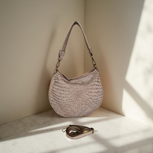 Load image into Gallery viewer, Woven handbag on a marble surface with soft lighting