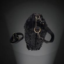 Load image into Gallery viewer, Black textured bag with gold hardware on a dark gray background