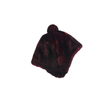 Load image into Gallery viewer, A fur cap made of mouton sheep fur, primarily black in colour with a pompom.