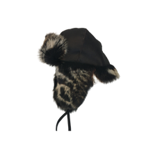 Load image into Gallery viewer, A black fur-lined trapper sheepskin cap with adjustable leather band.