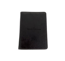 Load image into Gallery viewer, A black and brown nubuck leather bifold wallet with a snap closure.