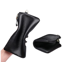 Load image into Gallery viewer, Black leather wallet held by a hand with 'Genuine Leather' and 'RFID Blocking Material' text on a white background.