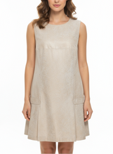 Load image into Gallery viewer, Woman wearing a beige sleeveless dress on a white background