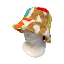 Load image into Gallery viewer, A colourful artificial fur  bucket hat on white mannequin head.