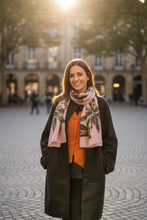 Load image into Gallery viewer, Woman wearing a long cardigan and orange top with a patterned scarf in an outdoor setting
