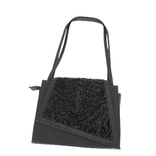 Load image into Gallery viewer, A black handbag featuring high-quality durable leather and astrakhan fur, with a zippered top, two handles, and a detachable shoulder strap.