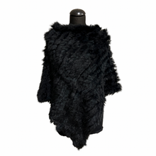 Load image into Gallery viewer, Black rabbit fur poncho displayed on a mannequin without fastening, featuring a round neckline and a soft, fluffy texture.