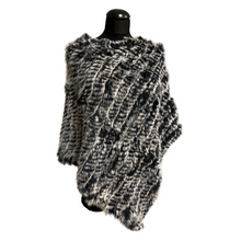 Load image into Gallery viewer, A knitted rabbit fur poncho with a round neckline displayed on a mannequin.