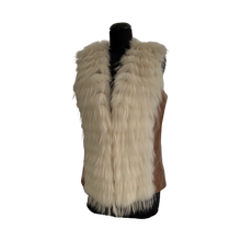 Load image into Gallery viewer, A beige color sheep leather vest with raccoon fur trimming, displayed on a mannequin. The mannequin is wearing a brown version of the vest, with the beige version shown in the image.