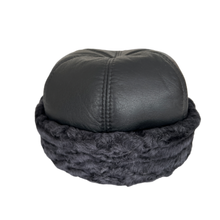 Load image into Gallery viewer, A round leather and astrakhan fur cap with a soft textile lining and no visible branding.
