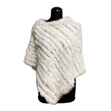 Load image into Gallery viewer, A white rabbit fur poncho displayed on a mannequin. The poncho is sleeveless with a round neckline and appears soft and furry.