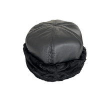 Load image into Gallery viewer, A round black leather and fur cap with astrakhan fur lining, designed for women.