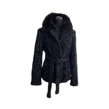 Load image into Gallery viewer, Black astrakhan fur jacket with a black Bluefox collar, featuring front pockets and fur hooks fastening, displayed on a mannequin.