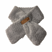 Load image into Gallery viewer, A beige artificial fur scarf with a decorative surface. It appears soft and plush, with a tag showing the brand name.