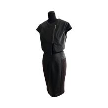 Load image into Gallery viewer, Black color midi length sheep leather skirt with a stretch wool layer, featuring a pencil silhouette, kick pleat, and an invisible zipper at the back.