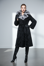 Įkelti nuotrauką į galerijos peržiūros programą, A long black textured fur coat with a wide light gray and white fur collar, displayed on a black mannequin against a light gray studio background.