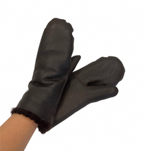 Load image into Gallery viewer, A pair of dark brown sheepskin mittens with a plush lining visible at the cuffs.