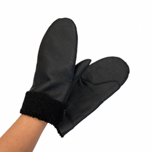 Load image into Gallery viewer, A pair of black sheepskin mittens with a visible soft inner lining, held up against a white background.