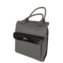 Load image into Gallery viewer, A dark grey leather handbag with black patent leather decoration on the outside pocket, featuring two handles and multiple compartments.