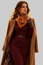 Įkelti nuotrauką į galerijos peržiūros programą, A woman models a stylish autumn outfit featuring a camel wool coat, a ribbed burgundy knit dress, a brown fur collar, brown leather gloves, and a brown handbag against a solid gray background.