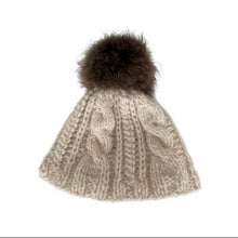 Load image into Gallery viewer, A beige knitted unisex  pom pom cap with a fur bobble on a white background