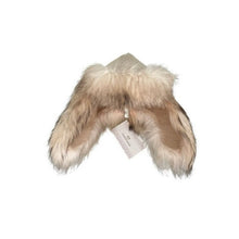 Load image into Gallery viewer, A white sheepskin fur cap with a soft texture, displayed against a white background, with a brand tag attached to it.