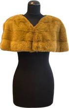 Load image into Gallery viewer, A brown mink bolero jacket with colourful lining and fur hook fastening at the front on a mannequin.