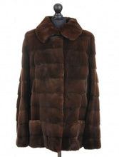 Load image into Gallery viewer, Brown sheared mink jacket with a stand collar, front pockets, and fur hooks fastening, displayed on a mannequin.