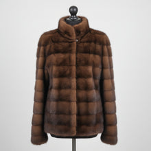 Įkelti nuotrauką į galerijos peržiūros programą, A brown mink jacket with a stand collar, front pockets, and fur hook fastening on a mannequin.