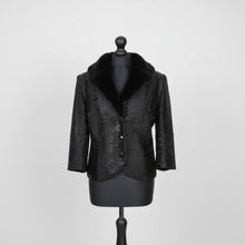 Įkelti nuotrauką į galerijos peržiūros programą, A black astrakhan fur lined jacket with a mandarin collar, button fastening, and small front pockets, displayed on a mannequin.