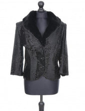 Load image into Gallery viewer, A black astrakhan fur lined jacket with a mandarin collar, button fastening, and small front pockets, displayed on a mannequin.