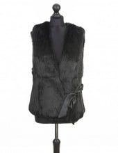 Load image into Gallery viewer, Black rabbit fur vest on a mannequin, featuring a silk ribbon fastening and interlining inside for structure.