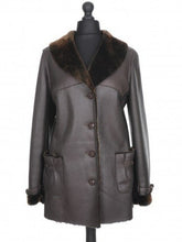 Load image into Gallery viewer, A dark brown Nappa sheepskin fur long jacket with a fur lining, featuring a regular collar, front pockets, and button fastening.