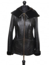 Load image into Gallery viewer, A dark brown color loose fit Nappa merino sheepskin fur coat with a hood, short, with a zipper opening and pockets at the front.