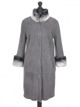 Load image into Gallery viewer, A gray knee-length suede sheepskin fur coat with turtleneck collar and front pockets, featuring 3/4 length sleeves and chinchilla trimmings.